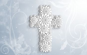 Risti, joka on koristeltu valkoisilla kukilla.
